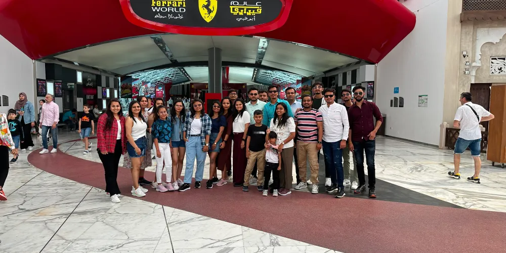 The team at the entrance of Ferrari World