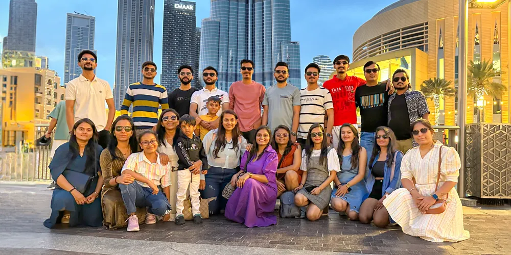 The team in front of the Burj Khalifa at dusk